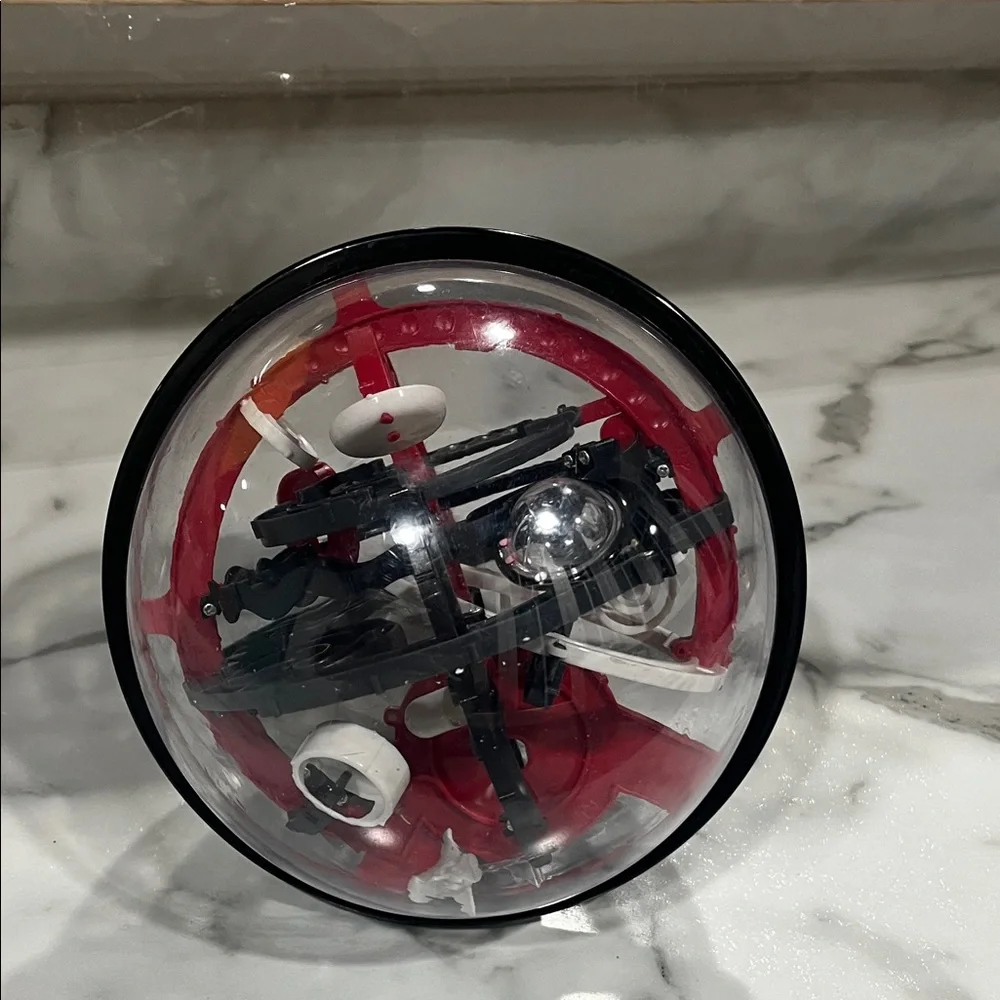 Perplexus Ball puzzle Interactive Red and Black Puzzle Sphere sharper‎ image